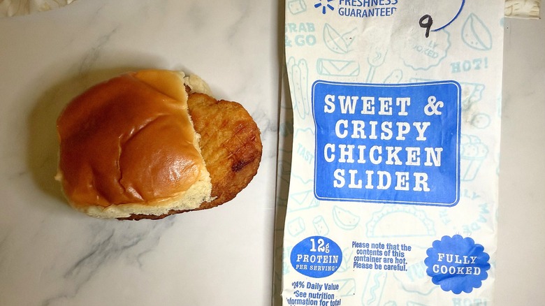 Walmart sweet & crispy chicken slider next to wrapper on marble surface