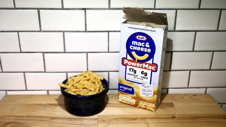 Kraft box of mac and cheese Power mac with prepared mac served in a bowl next to it