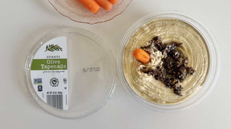 Park Street Deli Olive Tapenade Hummus container with a carrot