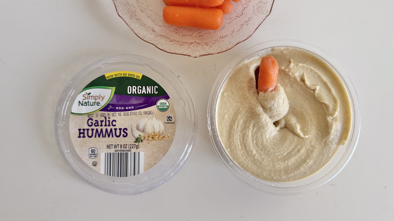 Open container of Simply Nature Organic Garlic Hummus