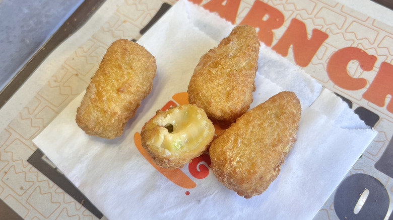 Jalapeño Cheddar Bites on a paper wrapper