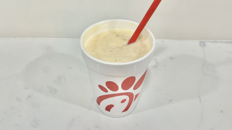 Chick-fil-A Peach Frosted Lemonade with straw.