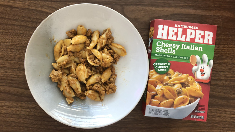 Helper cheesy Italian shells in a bowl.