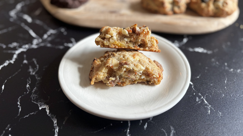 Levain carrot cake cookie split in half on plate