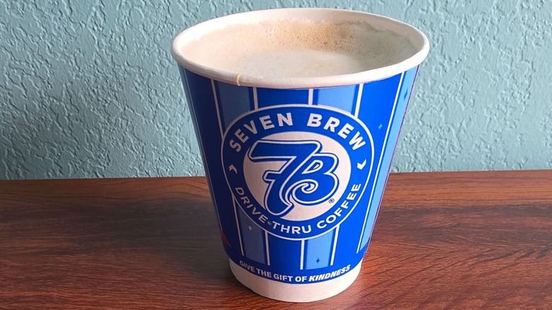 Cup of funnel cake macchiato on table