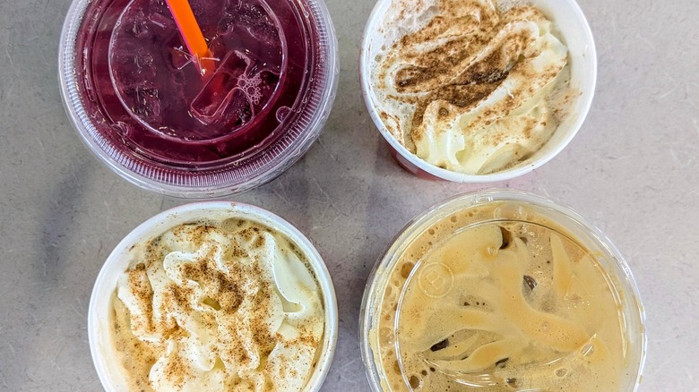 Top-down views of Dunkin's 2025 holiday menu drinks