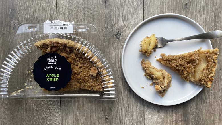 Fresh Market apple crisp pie in container and with slices pulled out on a plate