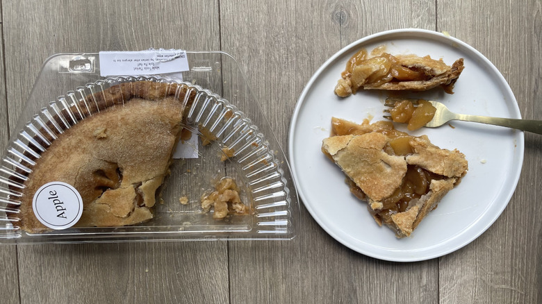 Whole Foods Apple pie in container and with slices pulled out on a plate