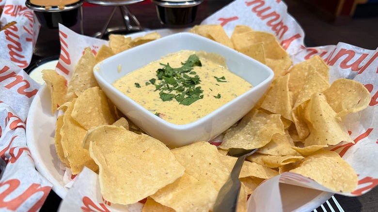 Chips and queso fundido in basket at Red Robin