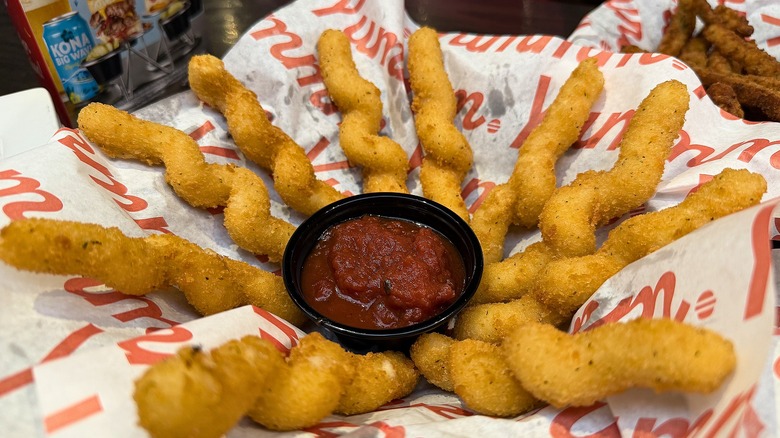 Close-up of Red Robin's Cheesy Mozzarella Twists in basket