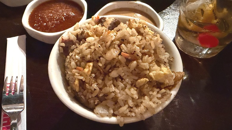 Close-up of Benihana wagyu fried rice in bowl on table at restaurant, sauces behind