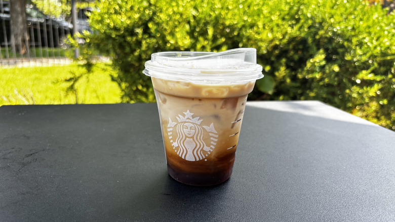 Starbucks iced shaken espresso drink on table