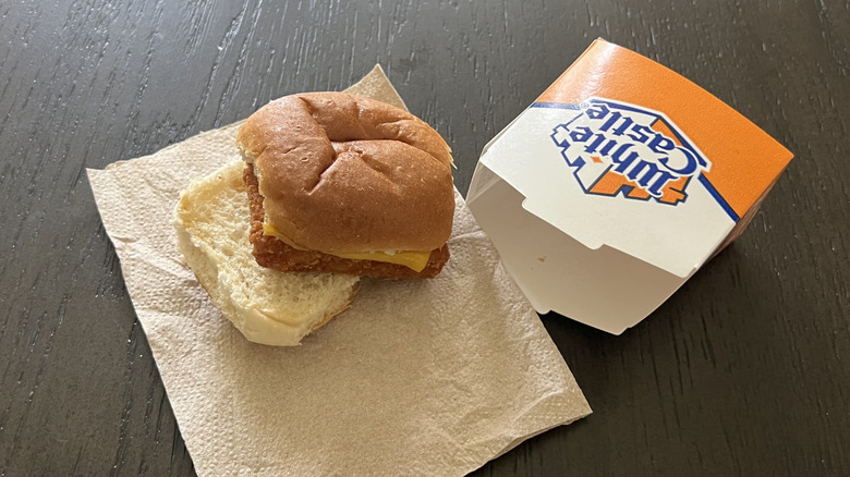 White Castle panko fish slider on a napkin next to an empty box