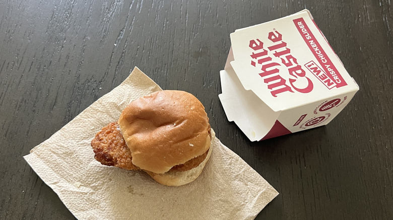 White Castle crispy chicken slider on a napkin next to a box