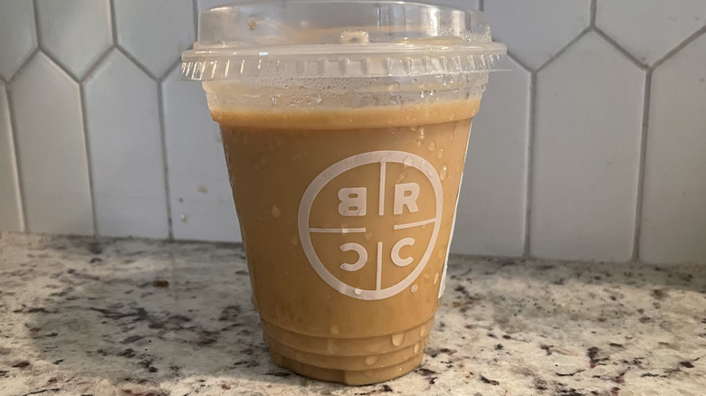 Black Rifle Coffee Company iced latte on a granite surface
