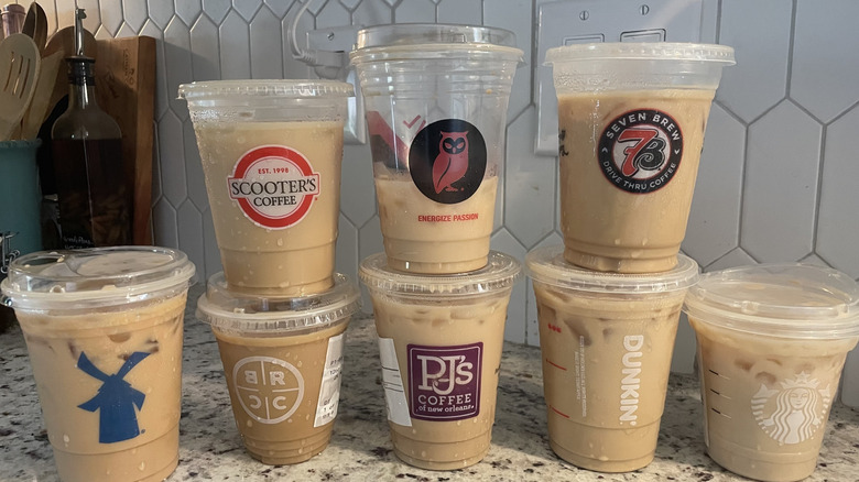 Assortment of Latte coffee's stacked on countertop