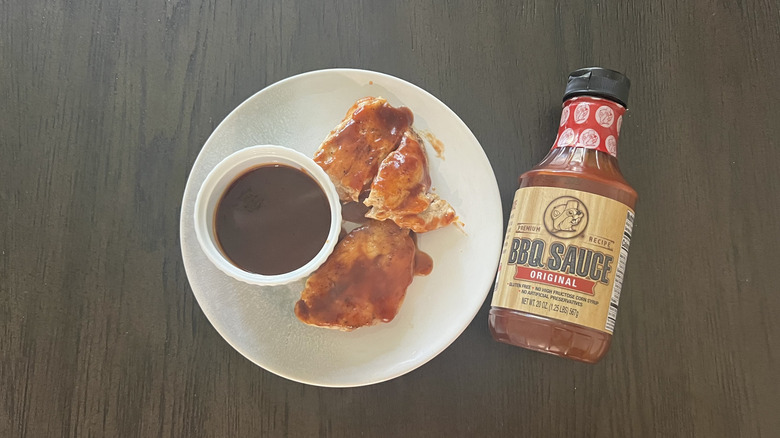 Buc-ee's BBQ sauce on chicken breast and in white ramekin.