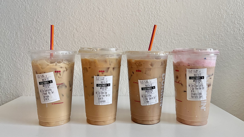 Four new Dunkin' coffee drinks lined up on a table