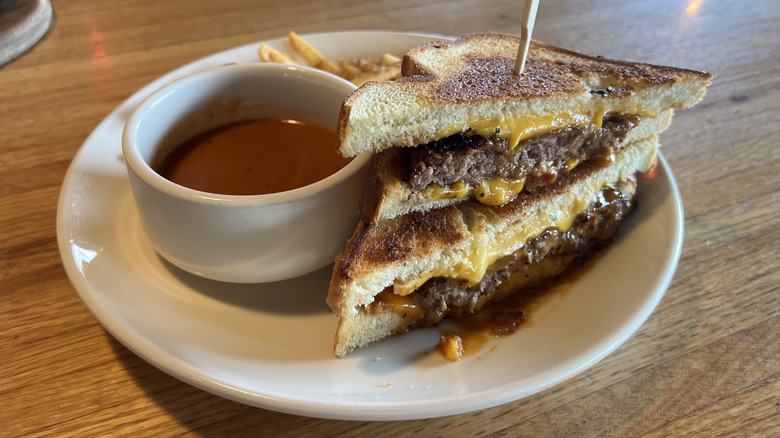 Applebee's Grilled Cheese Cheeseburger and fries on plate.
