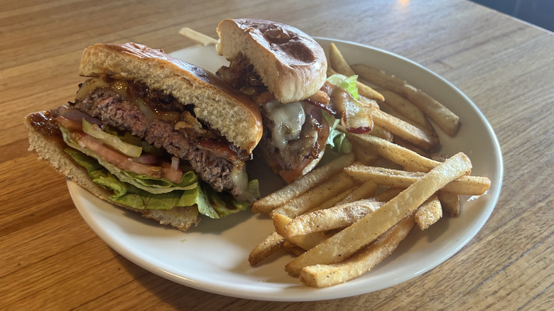 Applebee's Whisky Bacon Burger and fries on plate.