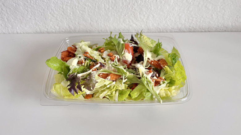 Side salad in a plastic container