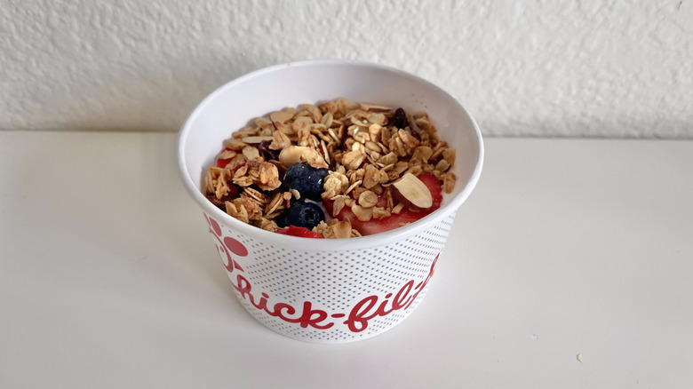 Berry parfait with granola in a container