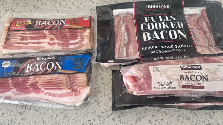Different packages of Kirkland bacon on counter