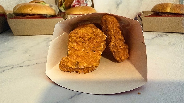 Wendy's Spicy Chicken Nuggets in container on marble surface
