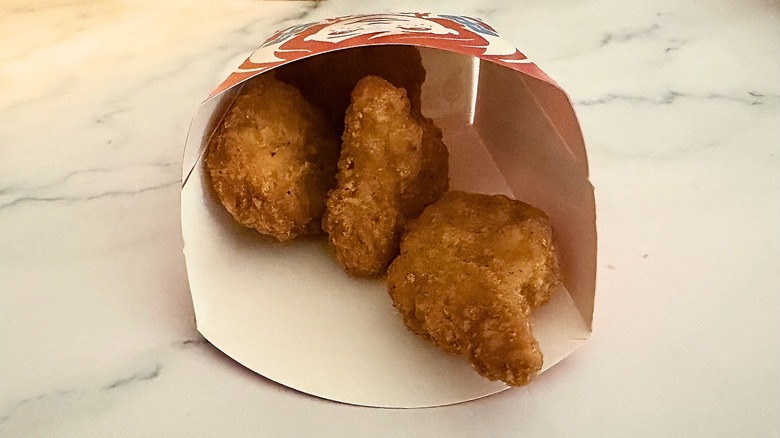 Wendy's Crispy Chicken Nuggets in container on marble surface