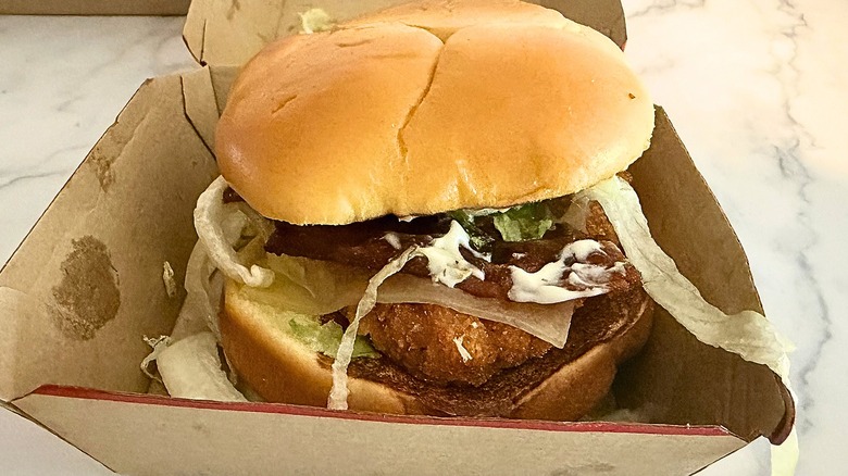 Wendy's Spicy Asiago Ranch Club sandwich in box on marble surface