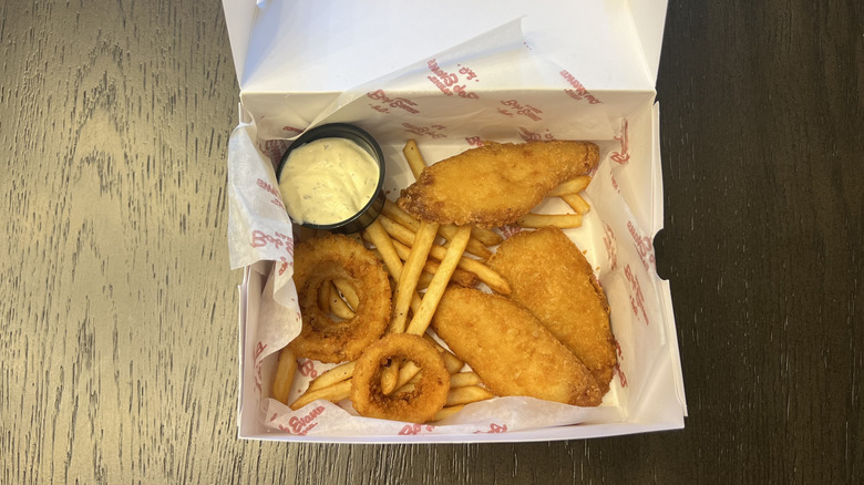 Bob Evans Fish Fry Platter in to-go box featuring fried fish, fries, onion rings, and tartar sauce