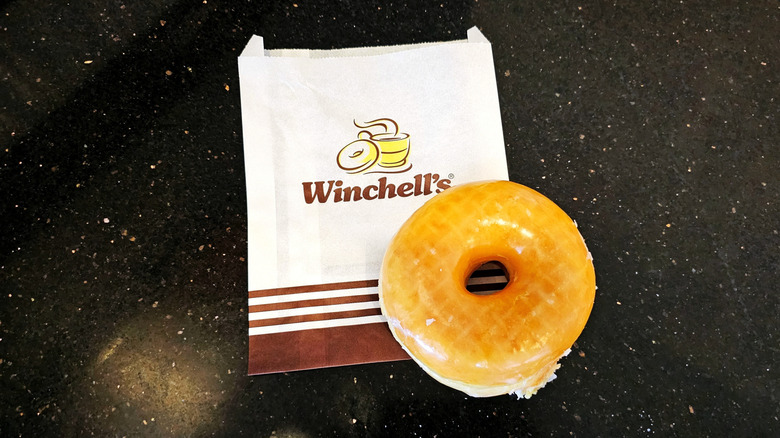 Glazed Raised donut on a Winchell's bag