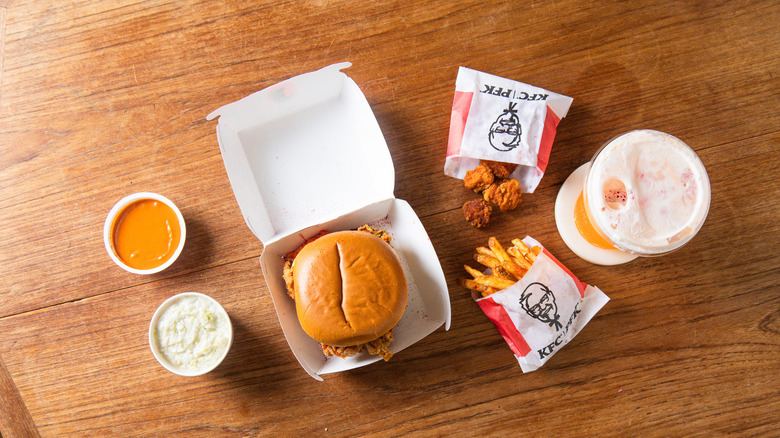 Side view of the Flamin' Hot Chicken Sandwich Box Meal on a table