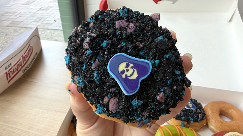 The new Krispy Kreme Skeletor Double Chocolate Doughnut covered in chocolate cookie crumbs