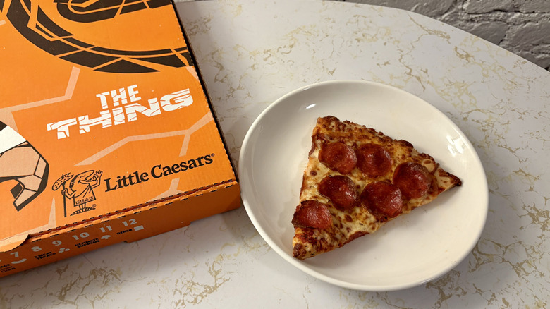 Little Caesars box and slice of pepperoni