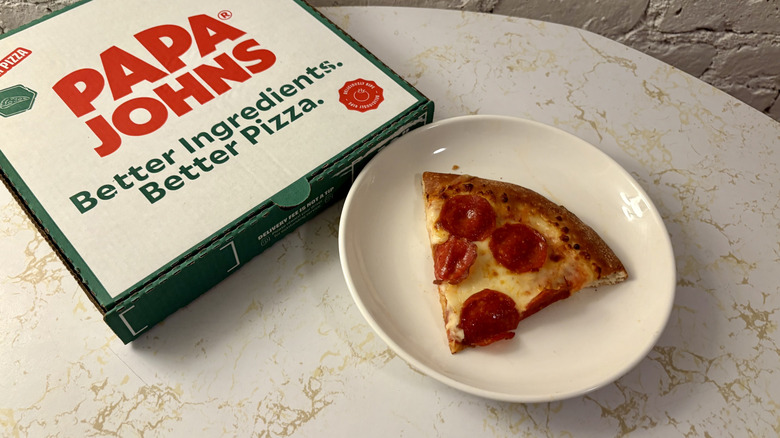 Papa John's box and slice of pepperoni