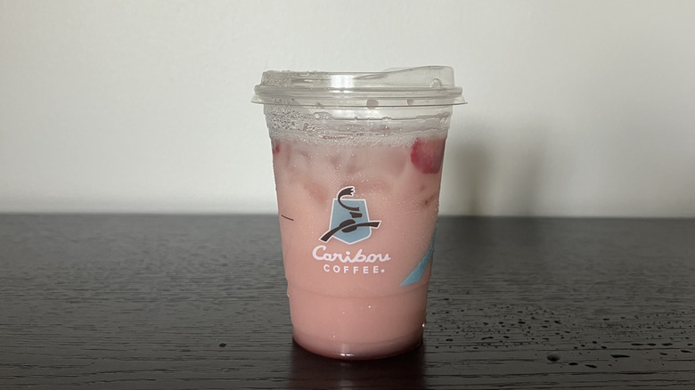 Caribou Coffee Strawberry Coconut Refresher in a to-go cup.