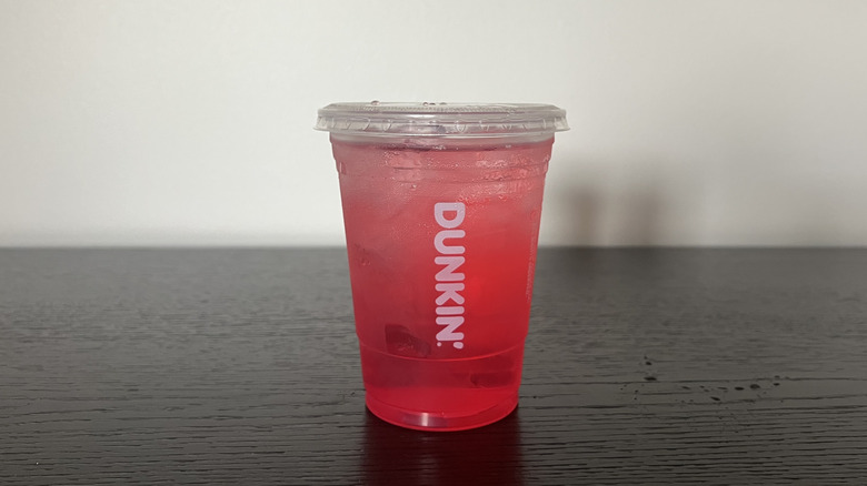 Dunkin' Donuts Strawberry Dragonfruit Refresher in to-go cup.