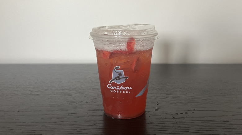 Caribou Coffee Strawberry Lemonade Refresher in a to-go cup.