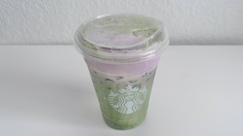 Iced Double Berry Matcha drink on table