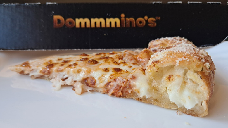 Side view of stuffed crust with cheese oozing out