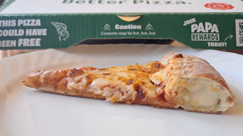 Side view of stuffed crust with cheese oozing out