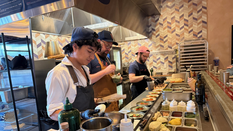 Chefs at Vesti preparing dishes for the Eating Menu experience