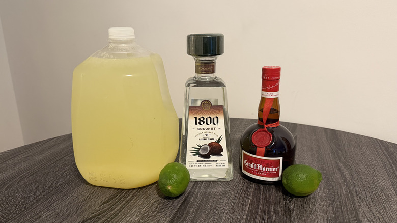 Gallon of lemonade, tequila, liqueur, and limes