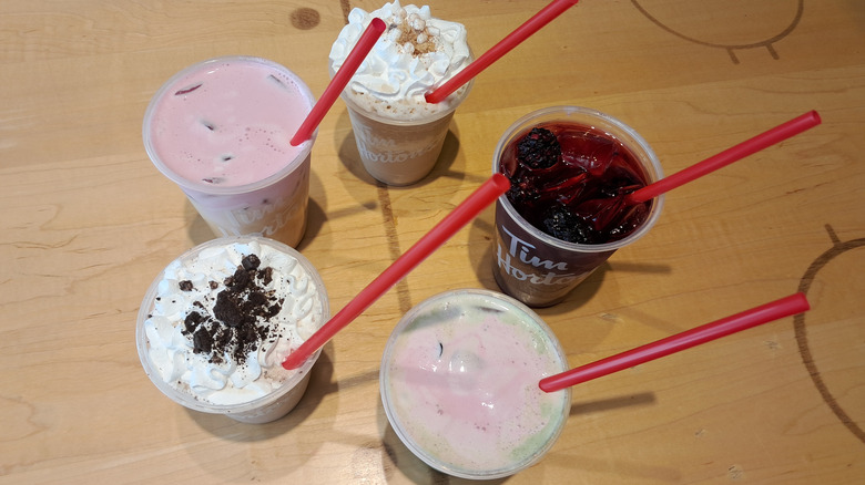 Five drinks with red straws