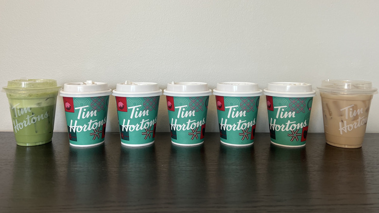 7 different Tim Hortons protein lattes in a line.