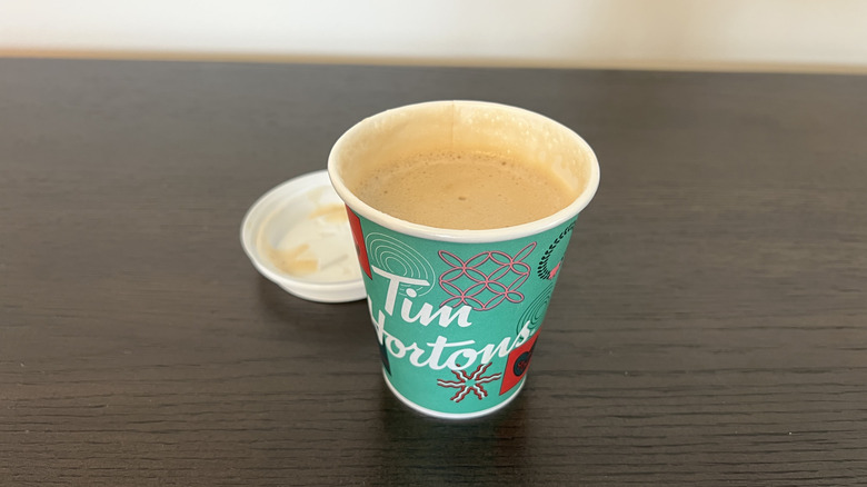 Tim Hortons classic protein latte in a to-go cup.