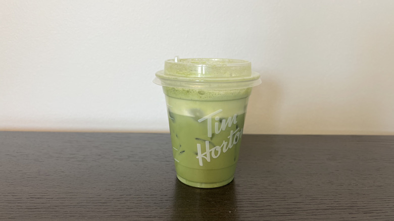 Tim Hortons iced matcha protein latte in plastic to-go cup.