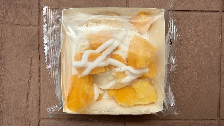 Plastic wrapped portion of Trader Joe's mango sticky rice