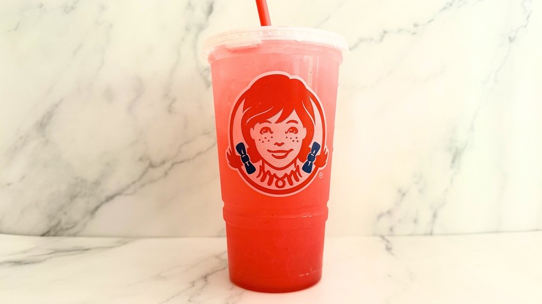 Wendy's Watermelon Lemonade in cup on marble surface